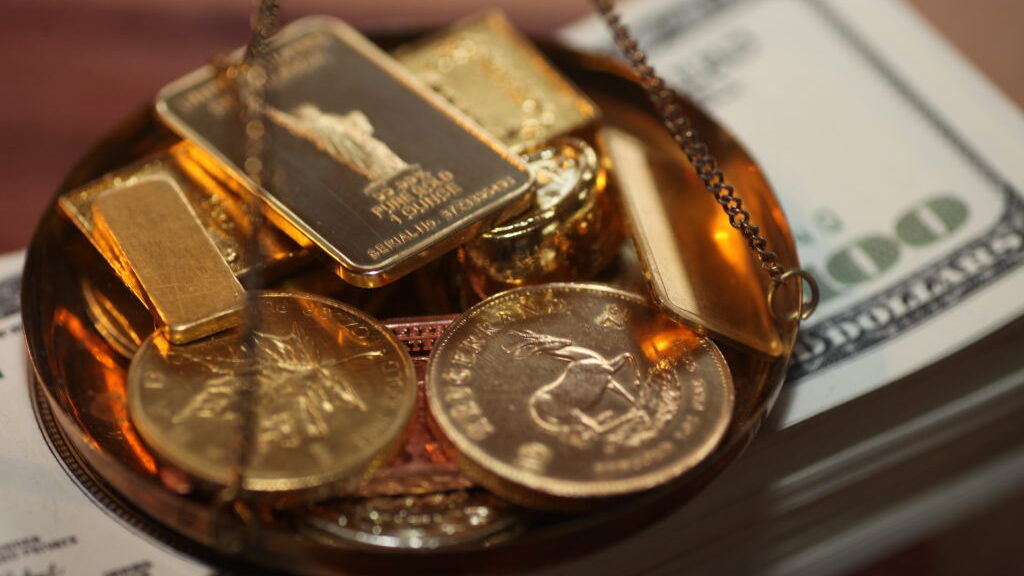 gold-price-eases-from-8-month-peak-as-investors-await-inflation-data